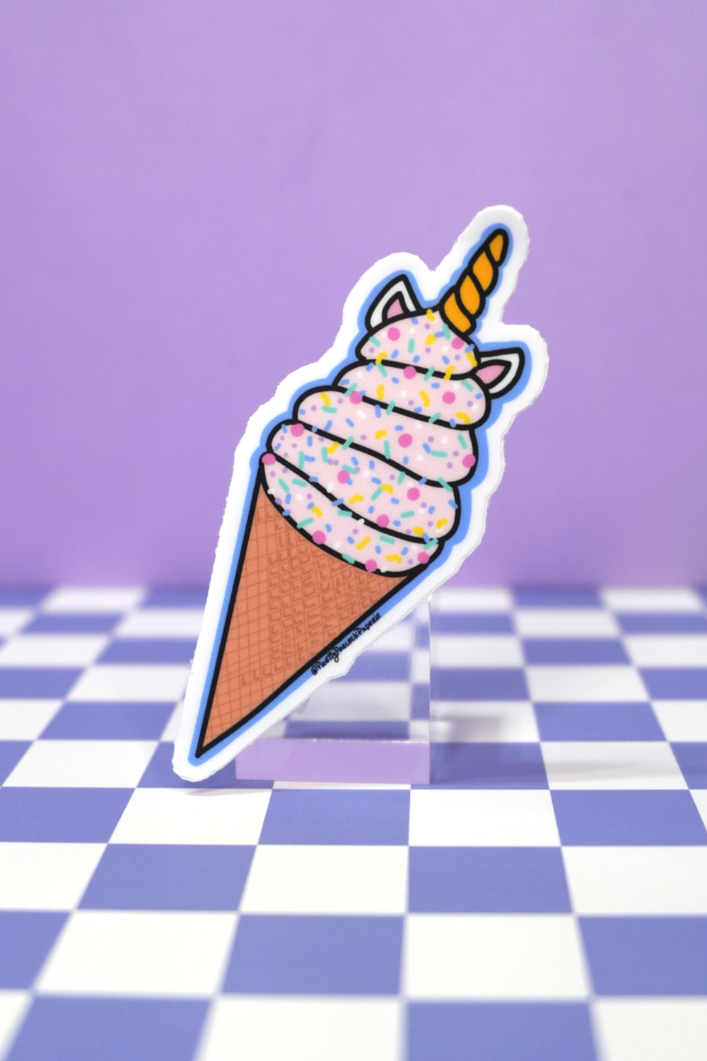artist drawn sticker on checkered purple background